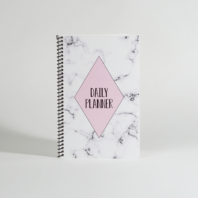 daily planner design shown propped up against a white backdrop